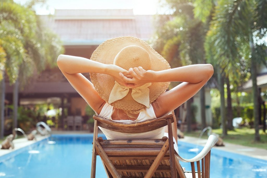 woman relaxing near the pool