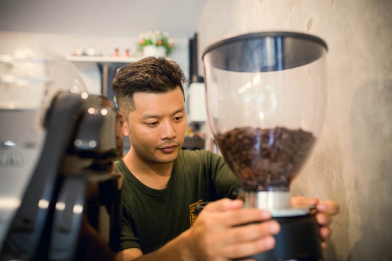 man fixing coffee machine