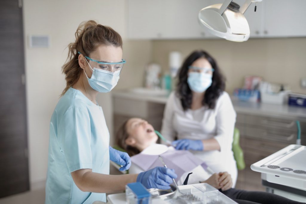 dentists working on a patient