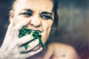 woman eating leaf